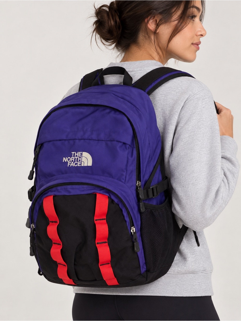 The North Face Purple and Black Backpack with Red Webbing